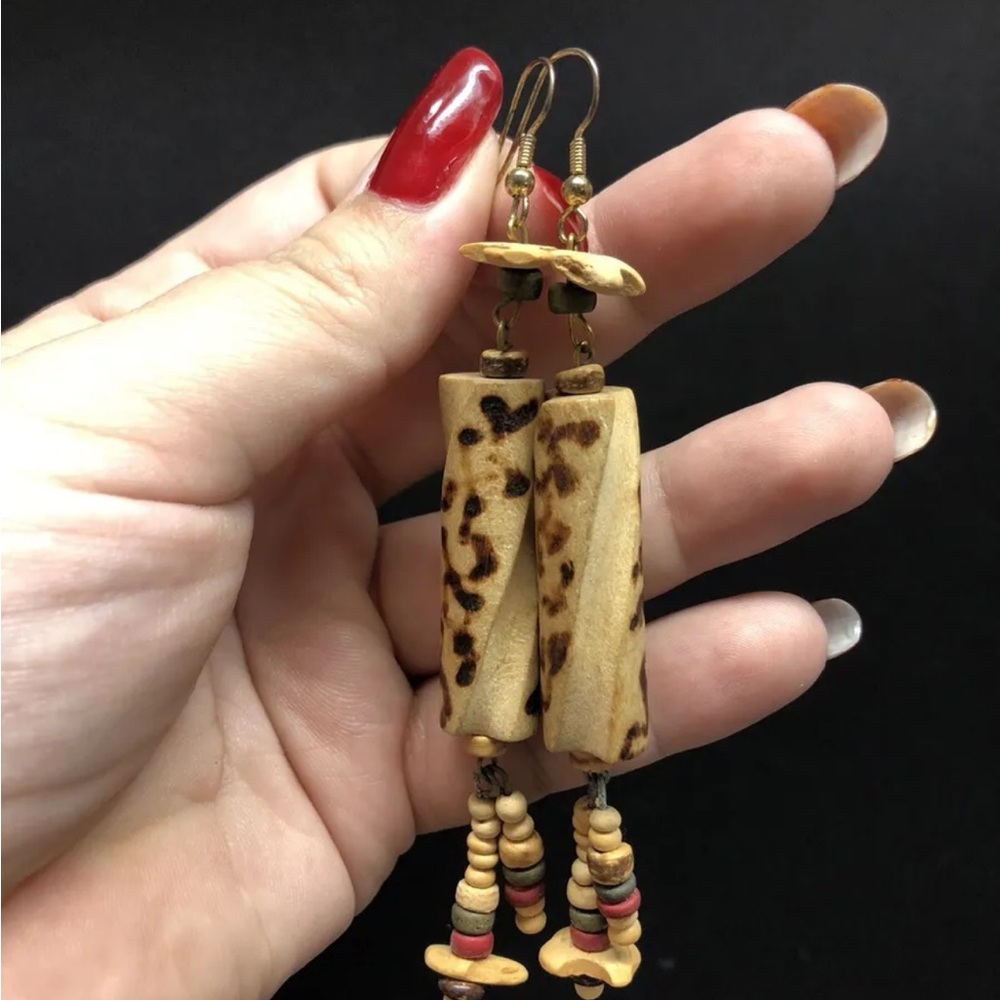 Long carved beaded earrings
